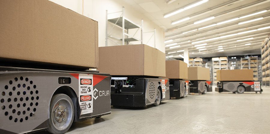 The smaller robot retrieves cartons from the lower storage levels and then delivered to a goods-to-person work station for picking.